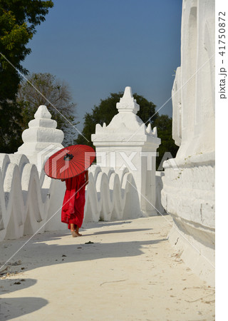 A Buddhist novice monk at white temple 41750872