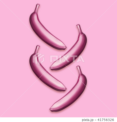 Purple metallic bananas on a pink background. A modern creative concept Purple metallic bananas on a pink background. A modern creative concept 41756326
