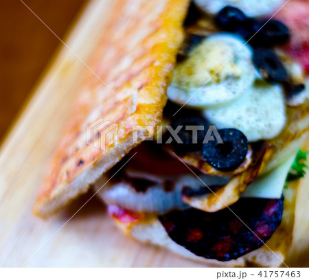 grilled sandwich with various cold meats 41757463