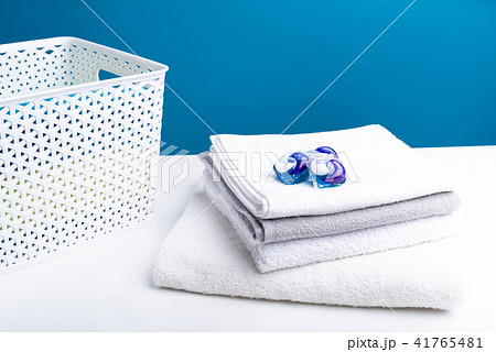Heap of soft washed laundry with detergent on top Heap of soft washed laundry with detergent on top 41765481