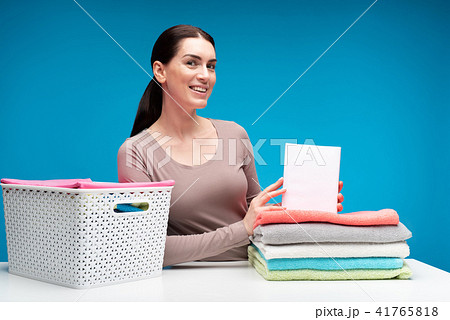 Delighted housewife satisfied with washing powder results Delighted housewife satisfied with washing powder results 41765818