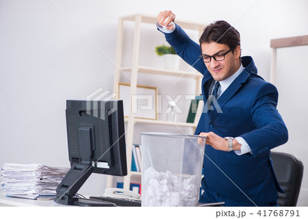Young handsome businessman employee working in office in paperwo 41768791