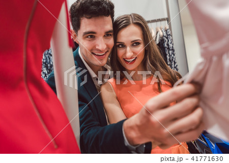 Woman and her man shopping for fashion Woman and her man shopping for fashion 41771630