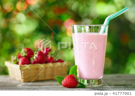 strawberry milkshake in glass on table 41777001