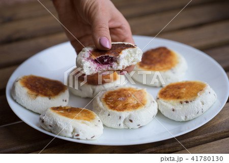 sweet cheese pancakes with cherries filling on a plate sweet cheese pancakes with cherries filling on a plate 41780130