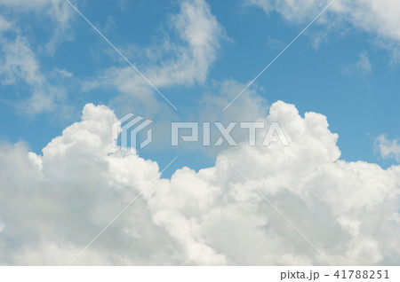 White cumulus clouds against the blue sky. The concept of weather White cumulus clouds against the blue sky. The concept of weather 41788251
