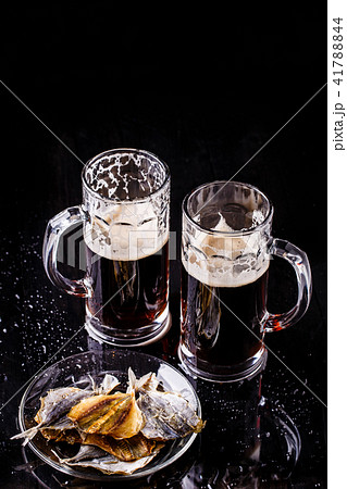 Mugs of beer with fish 41788844