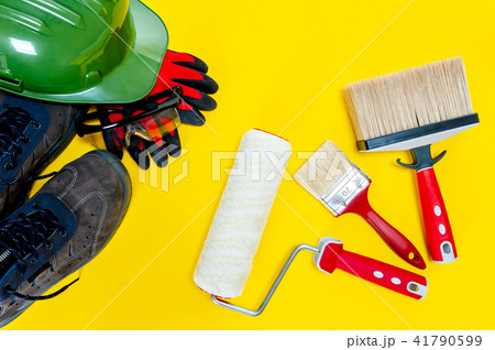 House painter, work tools on yellow background 41790599