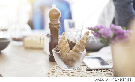 Some pieces of roasted bread in a transparent dish on a table 41791441