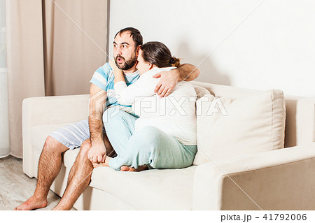 Couple watching a horror movie together. 41792006