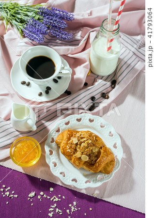 Breakfast set. Bread with jam over the disk on table set background, serve with coffee cup with white milk in glass and Bottle, top view, Healthy food concept 41793064