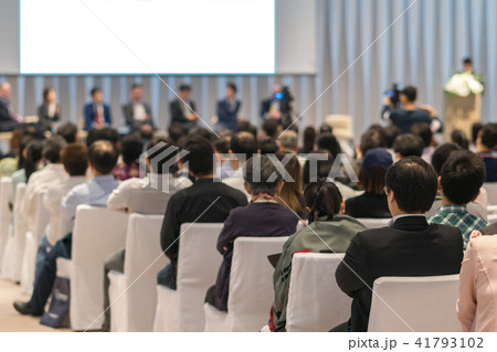 Rear view of Audience in the conference hall or seminar meeting which have Speakers on the stage, business and education about investment concept Rear view of Audience in the conference hall or seminar meeting which have Speakers on the stage, business and education about investment concept 41793102