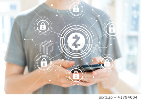 Zcash cryptocurrency security theme with man using a smartphone Zcash cryptocurrency security theme with man using a smartphone 41794004