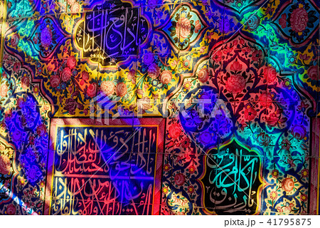 Colorful light from stained glass window on wall  41795875