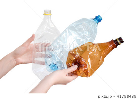 Female hand holding empty plastic bottle isolated Female hand holding empty plastic bottle isolated 41798439