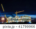 Crane and building construction site at sunset. 41799966