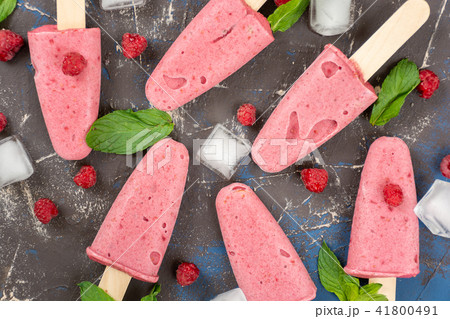 Homemade raspberry popsicles 41800491