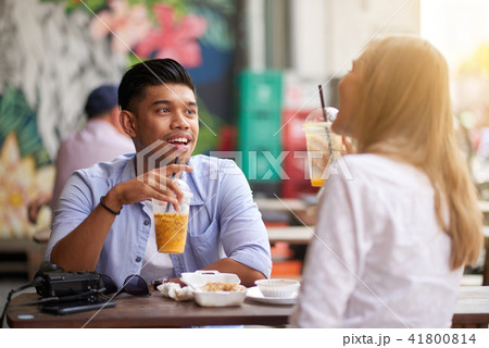 Enjoying smoothie and conversation Enjoying smoothie and conversation 41800814