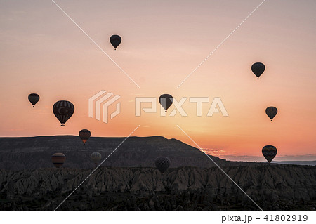 The great tourist attraction of Cappadocia - balloon flight on Sunrise. Cappadocia is known around The great tourist attraction of Cappadocia - balloon flight on Sunrise. Cappadocia is known around 41802919