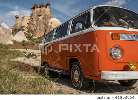 Retro Bus in Cave house of Fairy Chimneys rocks mushroom in Pasabag, Monks Valley, Cappadocia 41803054