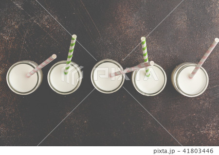 Milk (vegan nuts milk) in glass bottles  41803446