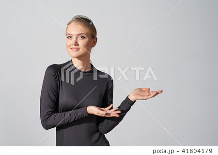 Woman in black shirt showing blank copy space in side 41804179