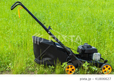 Modern gasoline powered lawn mower Modern gasoline powered lawn mower 41806627