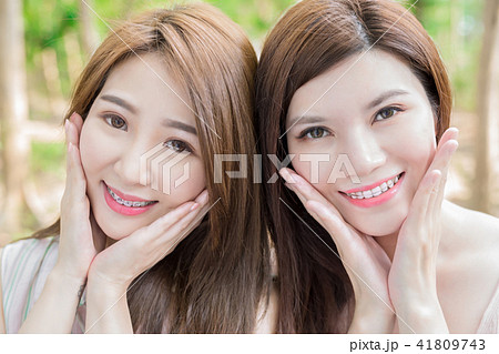 two beauty women smile happily two beauty women smile happily 41809743