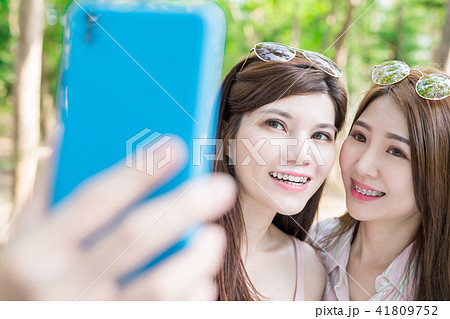 two beauty women selfie happily two beauty women selfie happily 41809752
