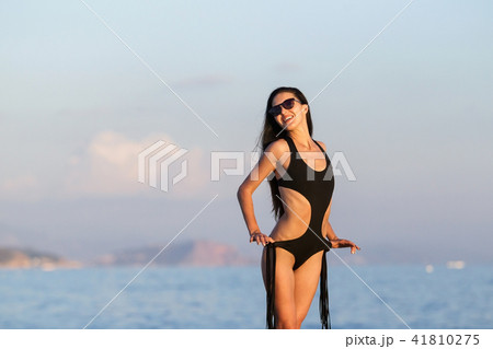 woman with perfect slim body near the sea woman with perfect slim body near the sea 41810275