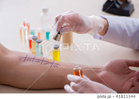 Doctor testing allergy reaction of patient in hospital Doctor testing allergy reaction of patient in hospital 41811344