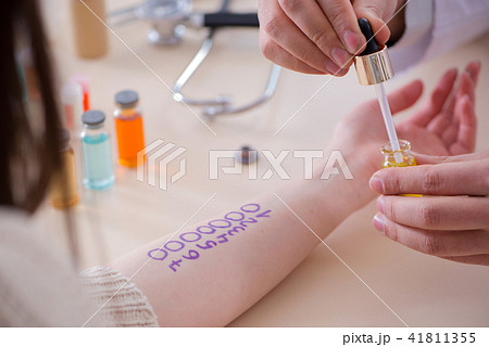 Doctor testing allergy reaction of patient in hospital 41811355