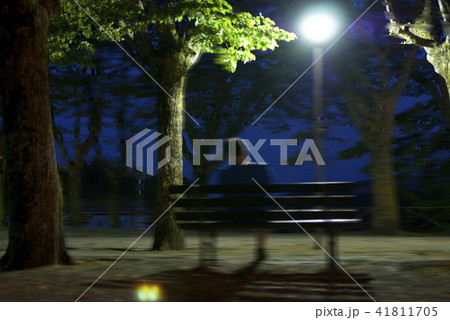 Male dark black silhouette on blurry night 41811705