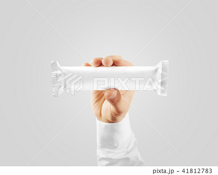 Blank white candy bar plastic wrap mock up holding hand Blank white candy bar plastic wrap mock up holding hand 41812783
