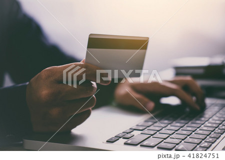 Man typing laptop for online shopping and pay by credit card, On 41824751