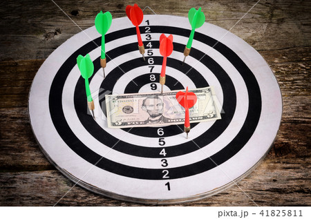 The money on a dartboard background The money on a dartboard background 41825811