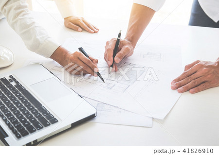 Close-up Of Person's engineer Hand Drawing Plan On Blue Print wi Close-up Of Person's engineer Hand Drawing Plan On Blue Print wi 41826910