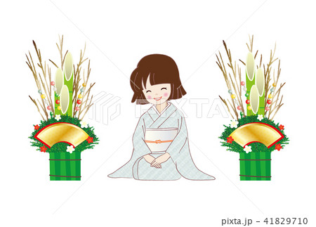 門松飾りと着物を着てほほ笑む女性 41829710