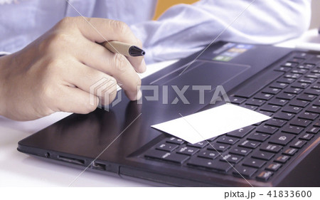 Hands using laptop and check business cards Hands using laptop and check business cards 41833600