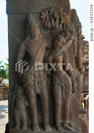 Carved figure of charming mithunas on the pillars Carved figure of charming mithunas on the pillars 41835709