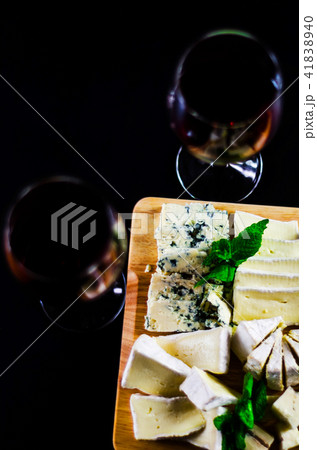 set of different cheeses on a wooden board 41838940