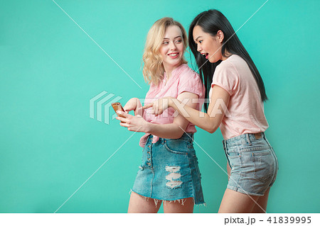 two multiethnic beautiful women asian and caucasian taking selfie at studio two multiethnic beautiful women asian and caucasian taking selfie at studio 41839995