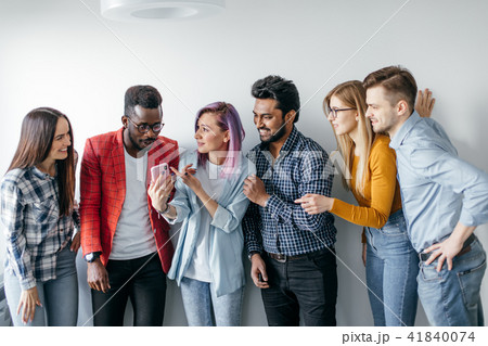 Multiethnic Group of Young People in Casual Wear isolated over grey background Multiethnic Group of Young People in Casual Wear isolated over grey background 41840074