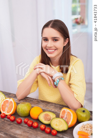 Attractive teen girl consuming fruits Attractive teen girl consuming fruits 41843733
