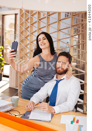 Amorous woman flirting with her boss Amorous woman flirting with her boss 41844000