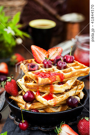 Belgian waffles with fresh berries and jam Belgian waffles with fresh berries and jam 41844570