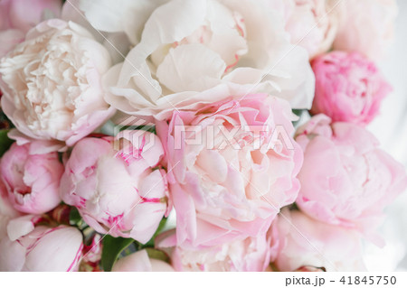 Floristry concept. Bouquet of beautiful flowers on gray table. Spring colors. the work of the Floristry concept. Bouquet of beautiful flowers on gray table. Spring colors. the work of the 41845750