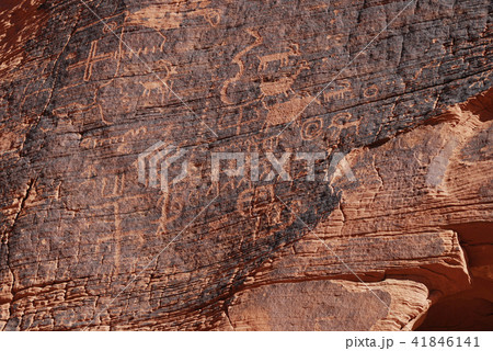 Ancient symbols on red sandstone 41846141