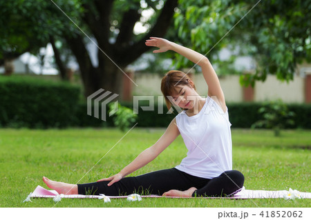 beautiful asian women doing yoga in park beautiful asian women doing yoga in park 41852062