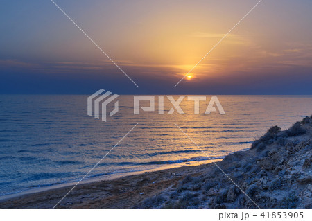 Sunset over the sea on wild beach of Persian gulf  41853905